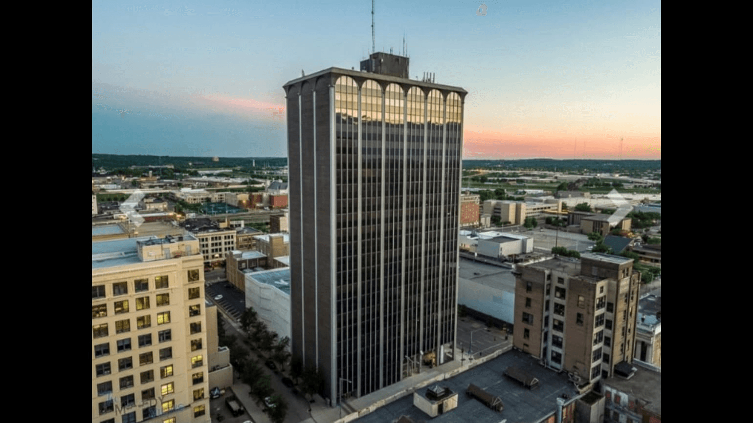 The Deneau building at sunset